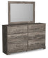 Ralinksi King Panel Bed with Mirrored Dresser